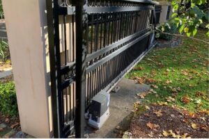 Existing sliding gate automated with a ground mounted motor